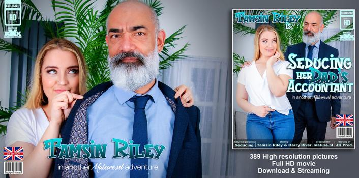 MatureNL – Young and horny Tamsin Riley is fucking and sucking her way older dad’s accountant on the couch
